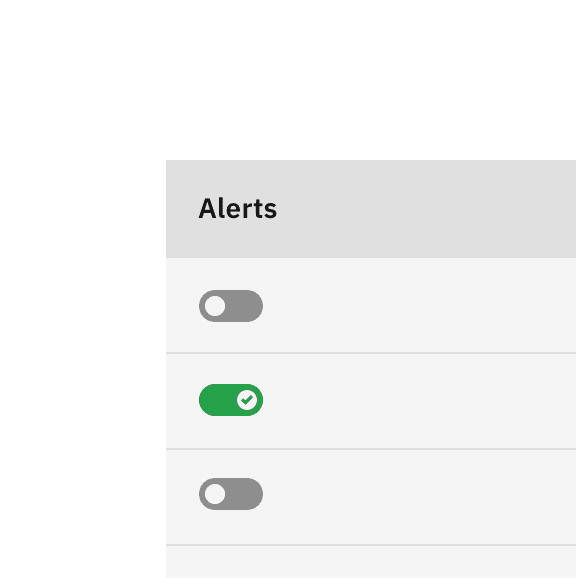 Toggles in the Alert column of a table show their "on" state with a green tickmark